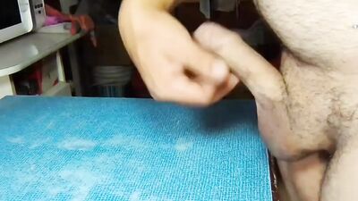 Chubby dude teases with his uncut cock and strokes it
