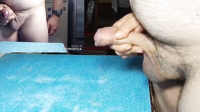 Chubby dude teases with his uncut cock and strokes it