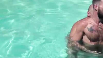 Three horny hunks suck each other off and fuck in an outdoor pool