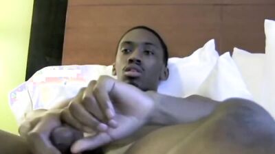 Skinny black guy with a huge cock tugs on it solo