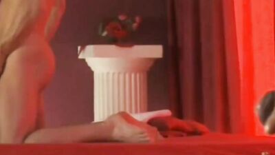 Attractive guy relaxes in a bath and strokes his huge cock