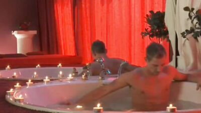 Hung guy tugs on his massive cock in a bath