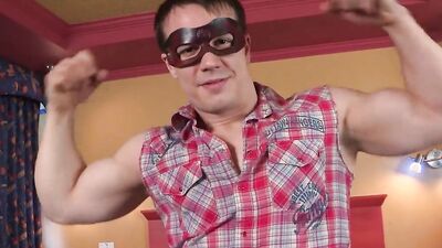 Buff jock with big muscles and a mask jerks off and uses a condom