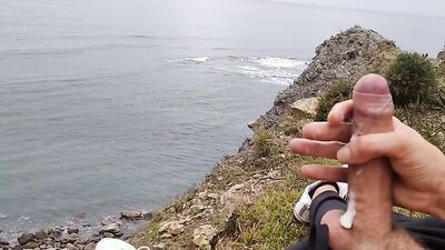 Amateur stud with a big cock films himself jerking off in nature