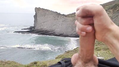 Amateur stud with a big cock films himself jerking off in nature