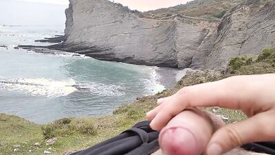 Amateur stud with a big cock films himself jerking off in nature