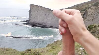 Amateur stud with a big cock films himself jerking off in nature