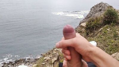 Amateur stud with a big cock films himself jerking off in nature