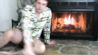 Naughty amateur takes his pants off and masturbates by the fireside
