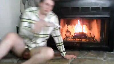 Naughty amateur takes his pants off and masturbates by the fireside