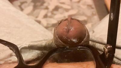 Perverted dude jerks off and cums on his thick glasses