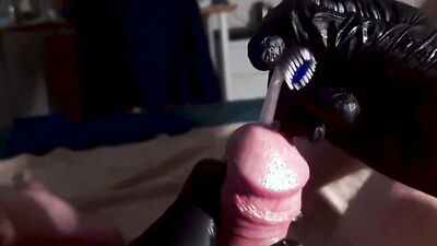 Perverted dude inserts a toothbrush in his big hard cock