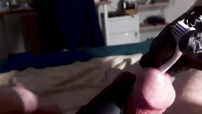 Perverted dude inserts a toothbrush in his big hard cock