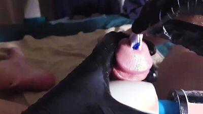 Perverted dude inserts a toothbrush in his big hard cock