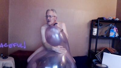 Kinky mature guy blows a balloon up and fucks it