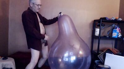 Kinky mature guy blows a balloon up and fucks it