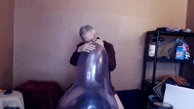 Kinky mature guy blows a balloon up and fucks it