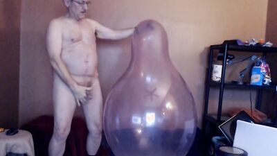 Kinky mature guy blows a balloon up and fucks it