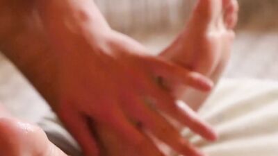 Fit young guy plays with his feet and body while jerking off