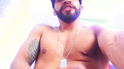 Striking dude with muscles and a beard jerks off solo