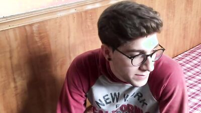 Slim twink with nerdy glasses and a huge cock jerks off