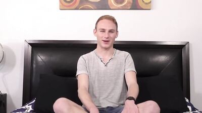 Cute young guy strips at an interview and uses lube to jerk off