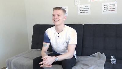 Gorgeous young blonde twink strips naked and strokes his cock