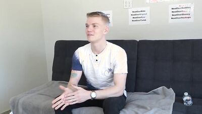 Gorgeous young blonde twink strips naked and strokes his cock