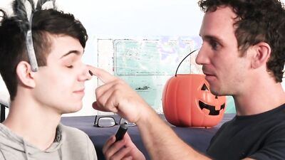 Twink dominated by two costumed studs and fucked in a threesome