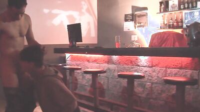 Twink sucks a huge cock in a bar before being analized