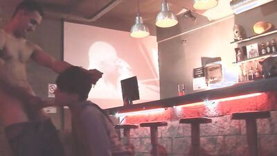 Twink sucks a huge cock in a bar before being analized