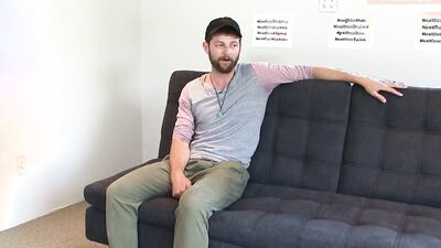 Fit bearded guy takes his fat cock out to masturbate