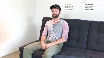 Fit bearded guy takes his fat cock out to masturbate