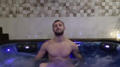 Handsome guy teases with his body and jerks off in a jacuzzi