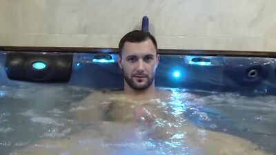 Handsome guy teases with his body and jerks off in a jacuzzi