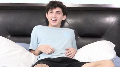 Twink strips naked after an interview and jerks off solo
