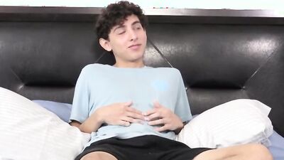 Twink strips naked after an interview and jerks off solo