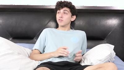 Twink strips naked after an interview and jerks off solo