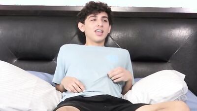 Twink strips naked after an interview and jerks off solo