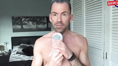 Athletic guy strips naked and reviews a kinky masturbation toy