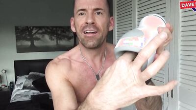 Athletic guy strips naked and reviews a kinky masturbation toy