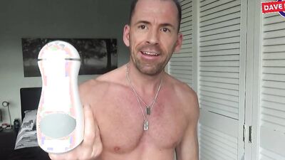 Athletic guy strips naked and reviews a kinky masturbation toy