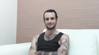Inked and skinny amateur strips after an interview and jerks off