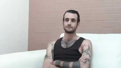 Inked and skinny amateur strips after an interview and jerks off