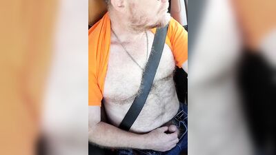 Hairy hunk with sexy glasses jerks off in a car