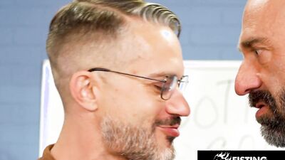 Bald hunk fingering a nerdy waiter to prepare him for fisting