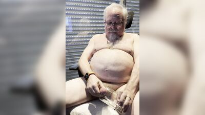 Chubby older guy with white beard and glasses jerks off