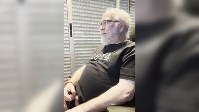 Chubby older guy with white beard and glasses jerks off