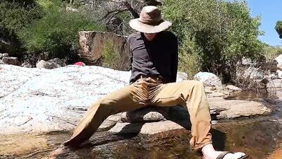 Horny dude goes to a creek in nature to jerk off