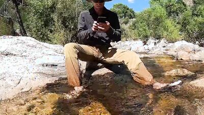 Horny dude goes to a creek in nature to jerk off